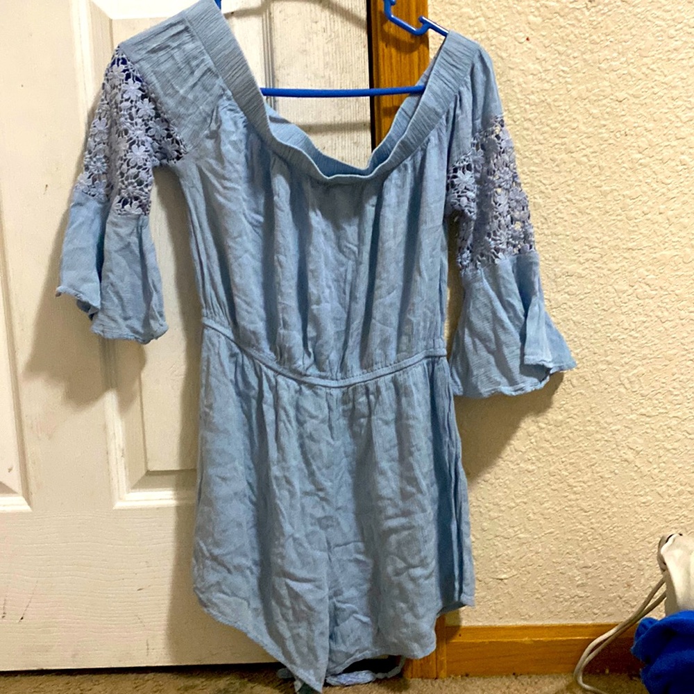 Blue Ramper with Ruffled Sleeves.